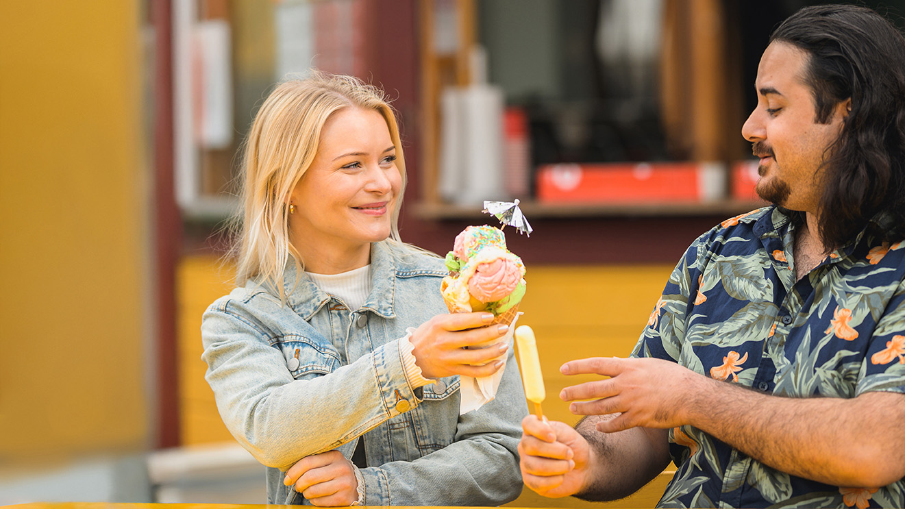 A women and a man eating ice cream.